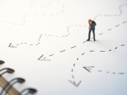 Businessman looking at different directions